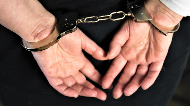 Hands in handcuffs