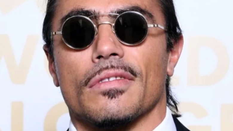 Salt Bae wearing sunglasses with slight frown