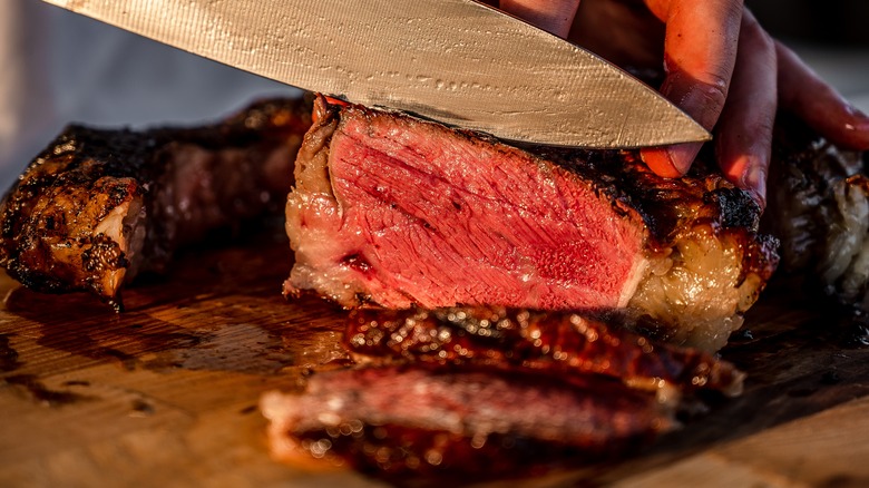 knife cutting into a steak