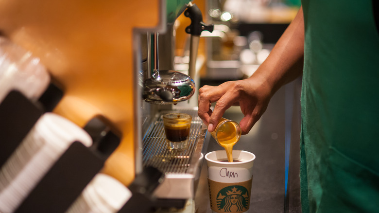 Starbucks barista making drink