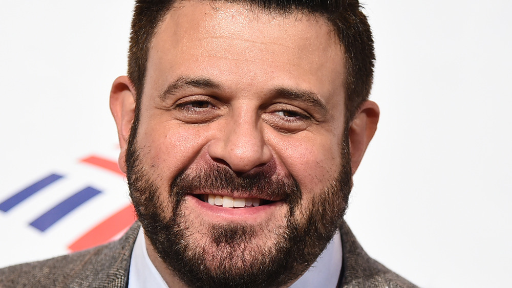 Adam Richman smiling at event