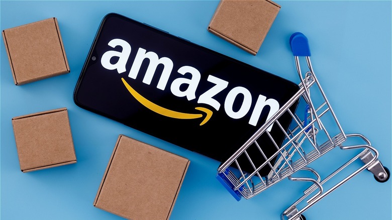 Amazon logo on phone in small cart