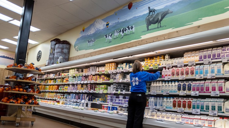 Trader Joe's employee stocking shelf