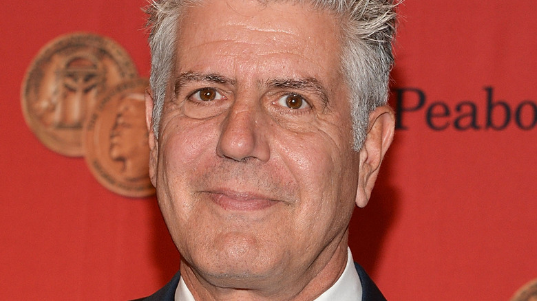 chef anthony bourdain smiles in close-up