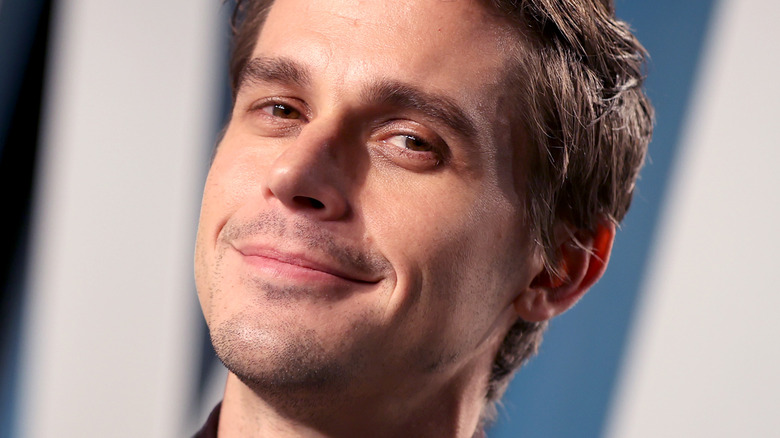 Antoni Porowski smirking