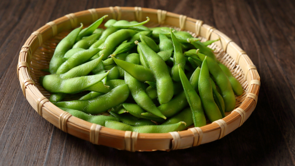 Bowl of edamame on table