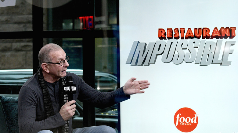 Robert Irvine and "Restaurant: Impossible" logo