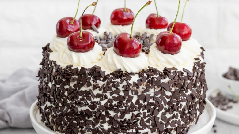 Black forest cake topped with cherries
