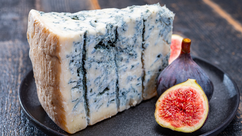 a wedge of blue cheese and figs