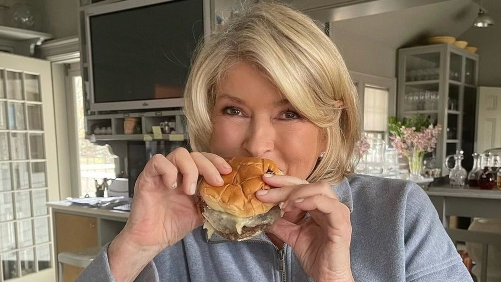 Martha Stewart eating a BurgerFi burger