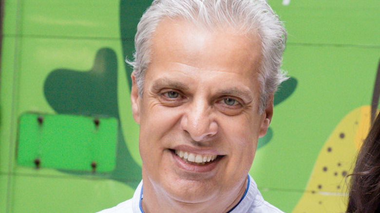 Chef Eric Ripert against green background