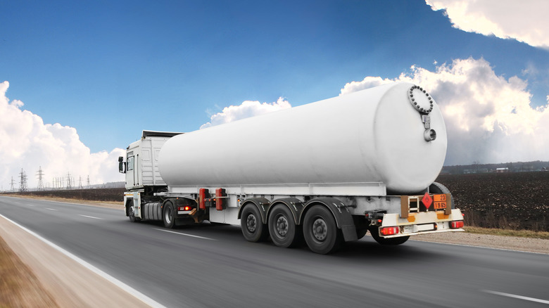 Tank truck speeding down highway