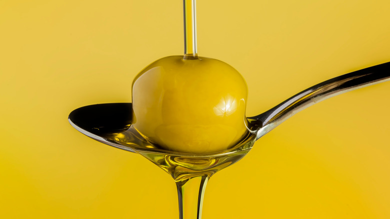 spoon, olive, and olive oil