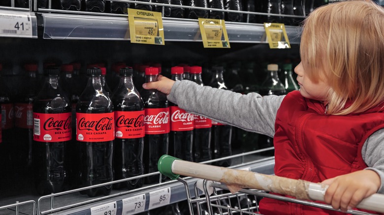 Shoppers grabbing Coca-Cola