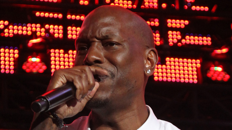 Tyrese Gibson close-up singing into microphone