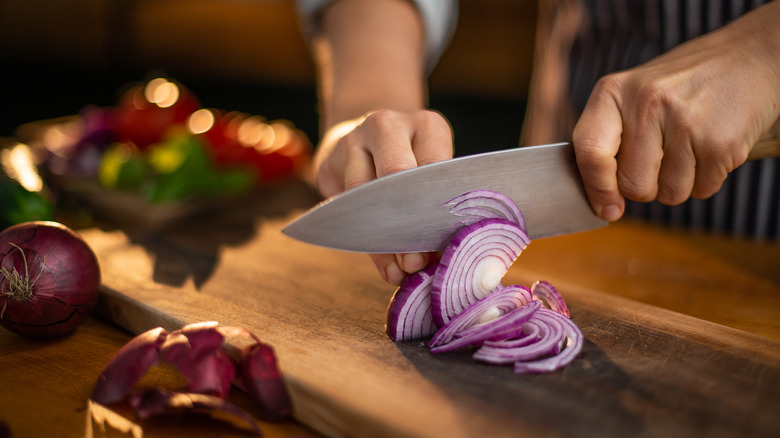 Chef chopping onions