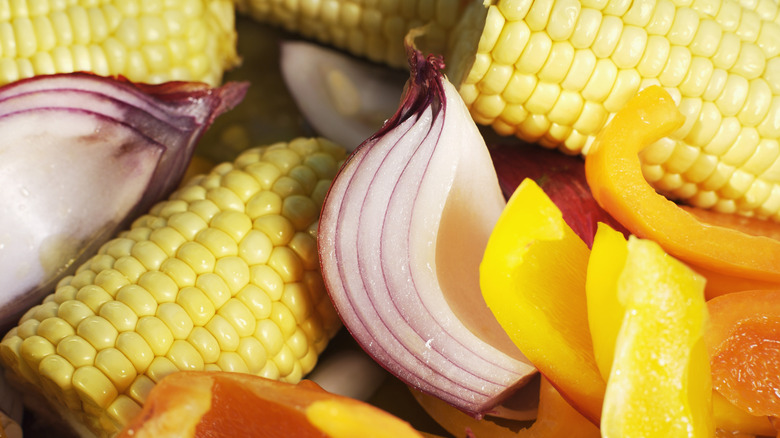 sliced corn cobs and red onion pieces