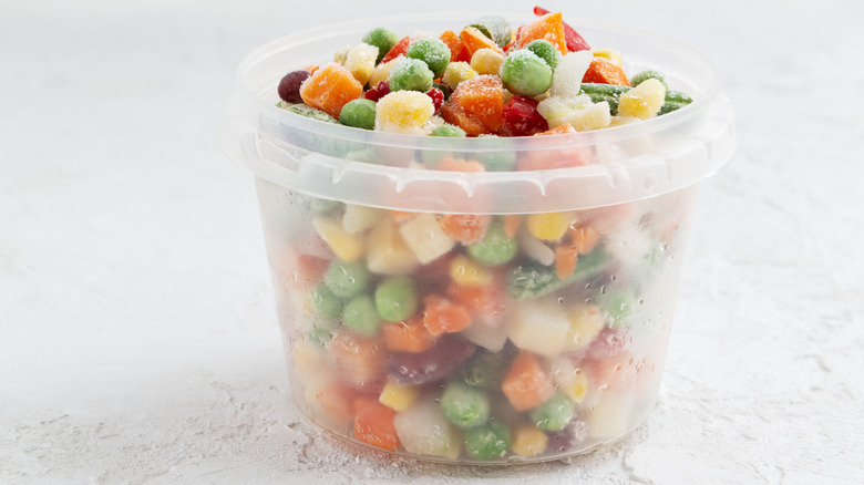 Frozen peppers, onions, and corn in plastic cup