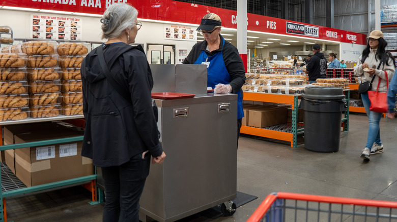 People at a Costco free sample station