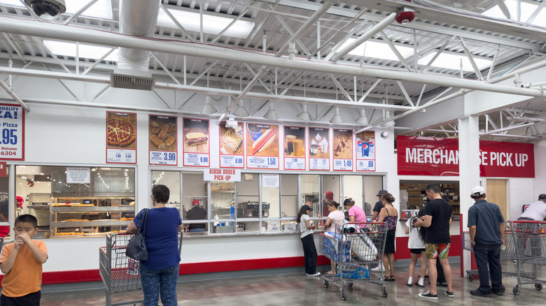 Customers in line at a Costco food court