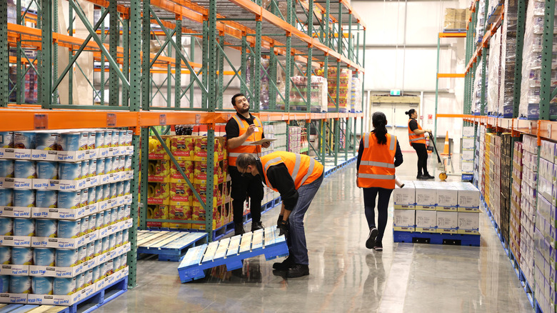 Stockers manage products at a Costco