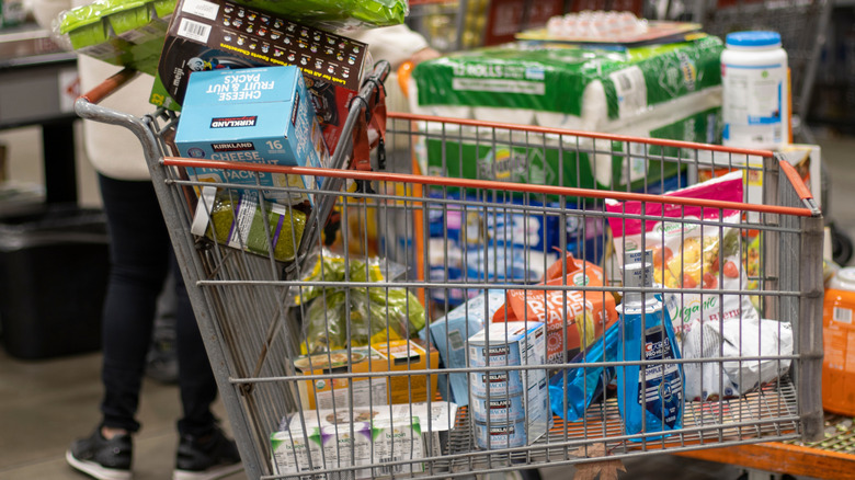 Various Kirkland Signature products in a Costco shopping cart