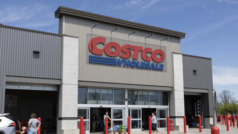 A Costco location featuring a pre-engineered metal facade with customers near entrance