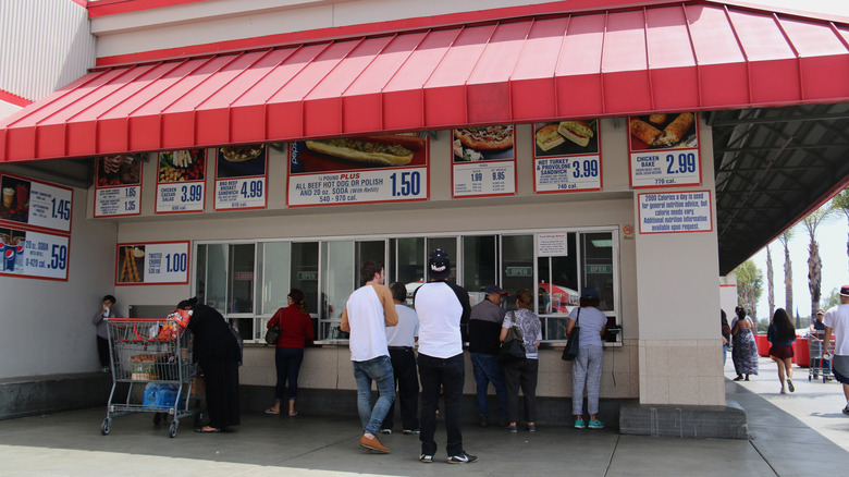 Costco shoppers gather to order at an outdoor food court