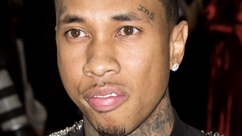 Closeup shot of rapper Tyga wearing earring