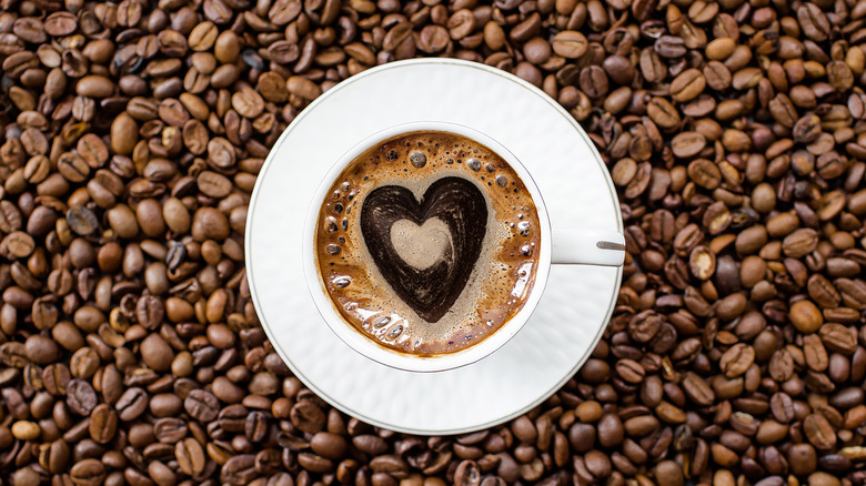 coffee beans and mug with heart 