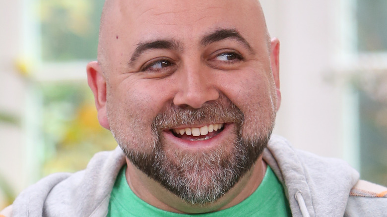 Duff Goldman in a green T-shirt and gray hoodie