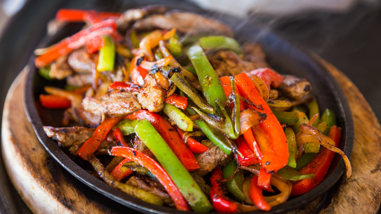 Beef fajita with peppers in pan