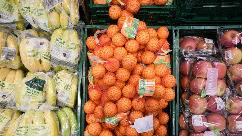 Produce selection of oranges, apples, and bananas at Aldi