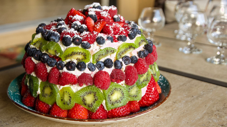 A cake decorated with fruit