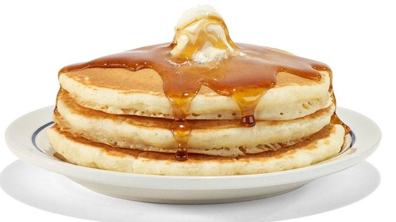 Stack of pancakes with butter and syrup