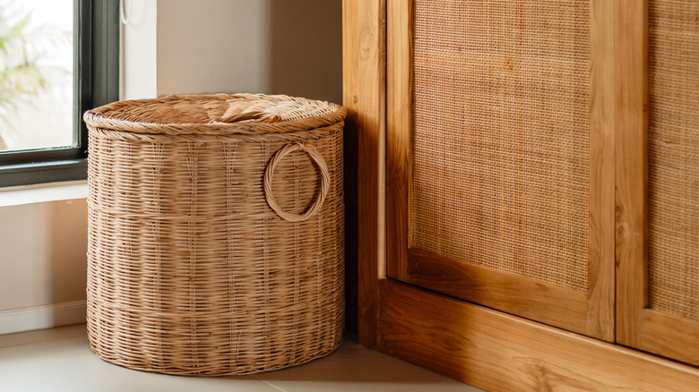 Woven basket against a window