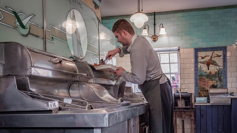 Man putting order into container