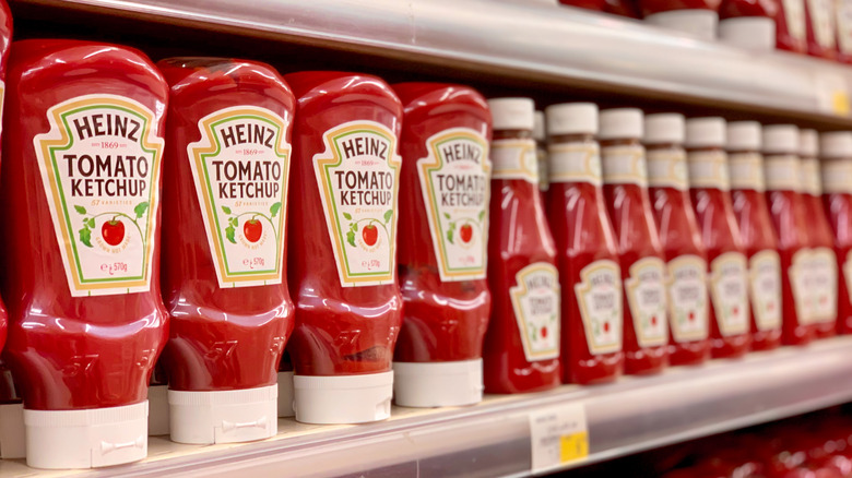 Ketchup bottles stacked in store