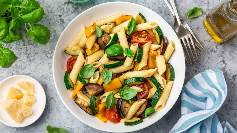 penne pasta alla crudaiola with zucchini, tomatoes, and basil