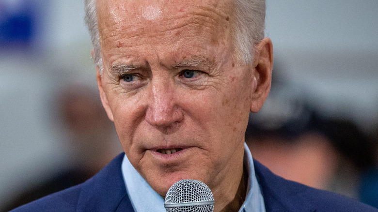 President Joe Biden with microphone