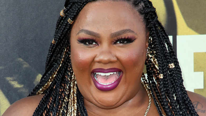 Nicole Byer smiling big