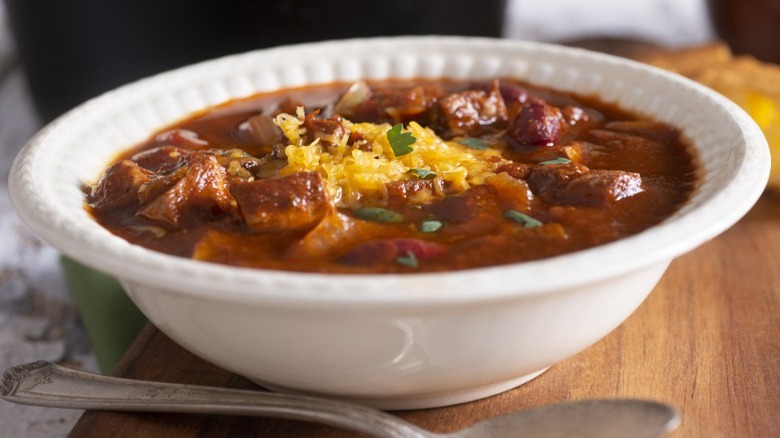 A white bowl filled with chili