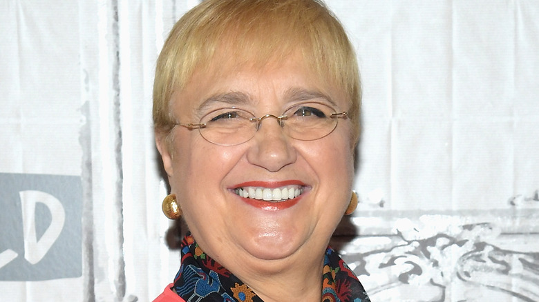  Lidia Bastianich smiles in glasses and red lipstick