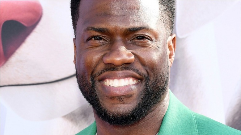 Kevin Hart smiling in green shirt
