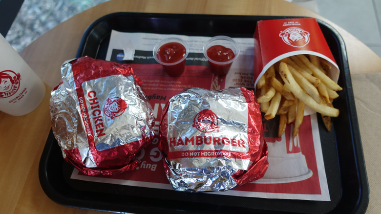 Wendy's chicken sandwich, hamburger, fries, and ketchup