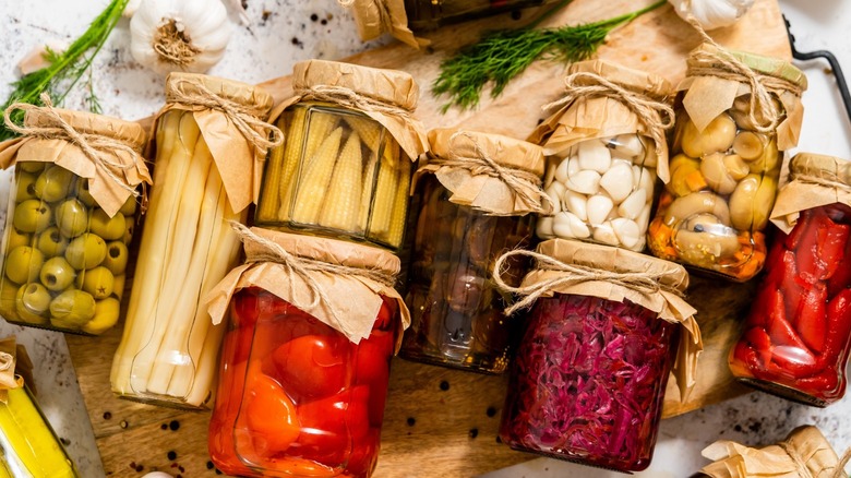 Fermenting vegetables in glass jars 