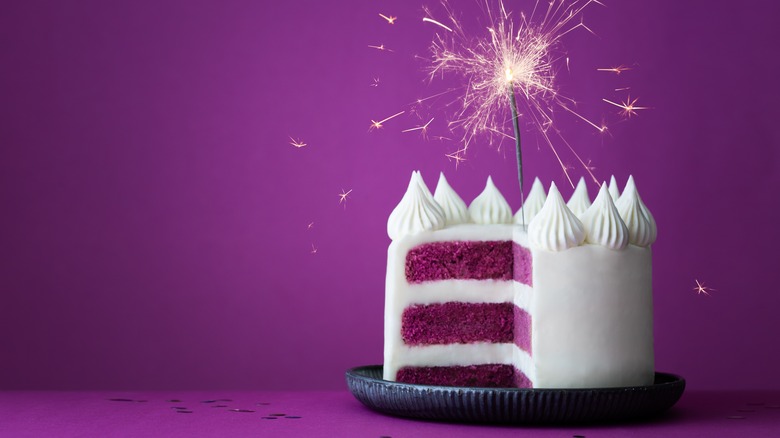 purple layer cake with sparkler