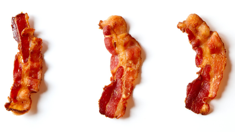 Slices of bacon on a white background