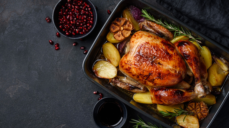 roasted whole chicken in pan