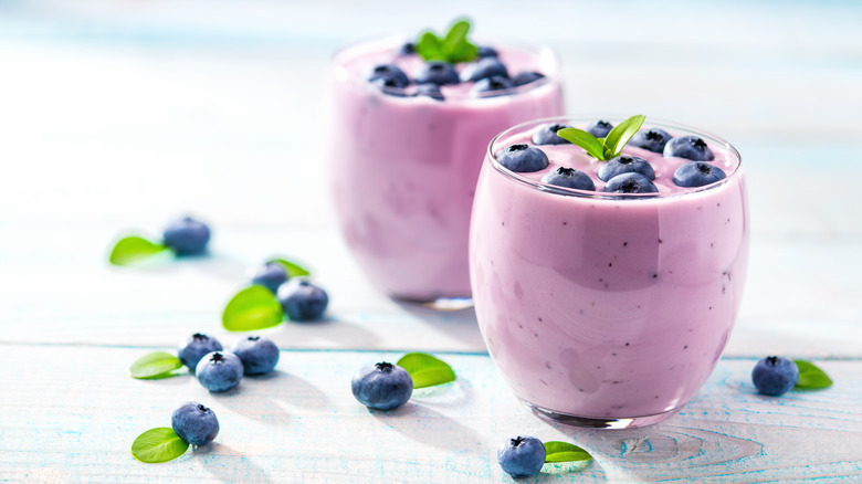 Two blueberry smoothies in glasses